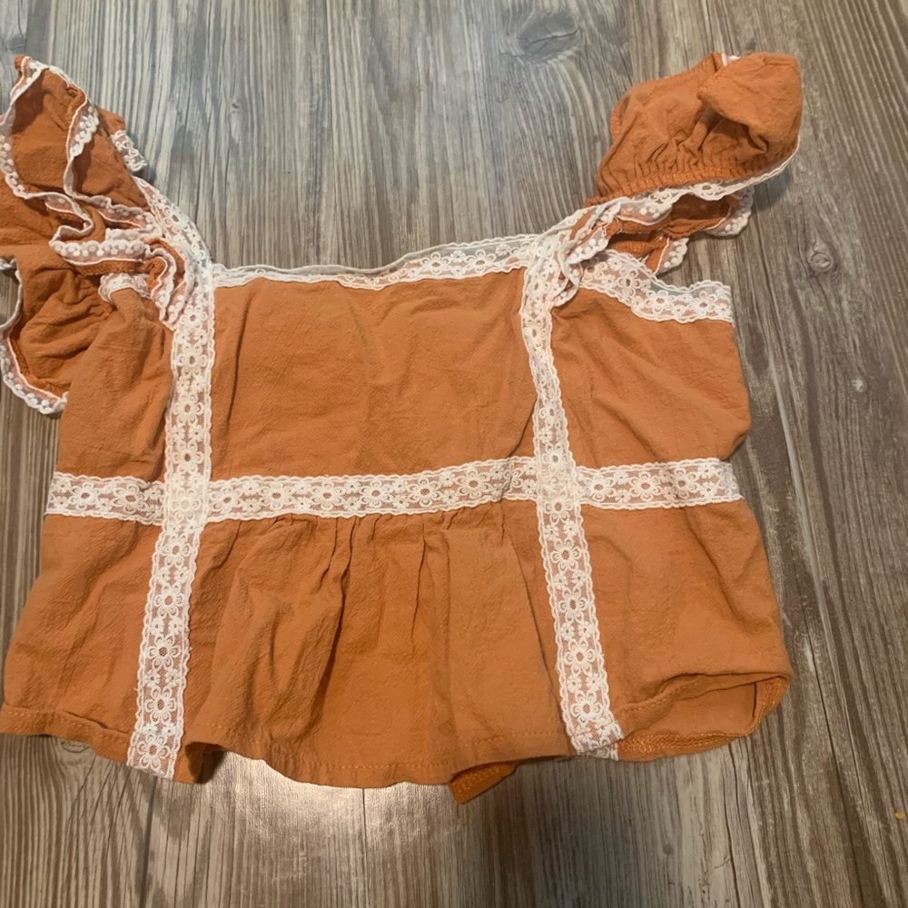 Orange ruffle top